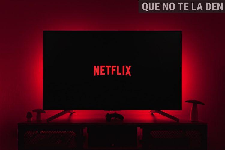 a television with the netflix logo lit up in the dark