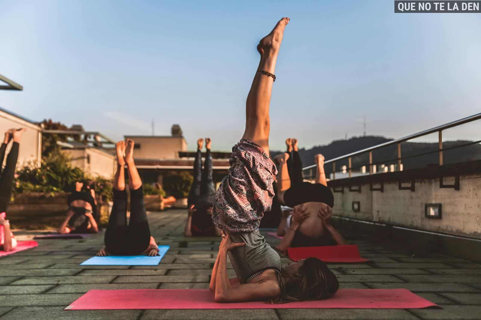 Group of Women Lying on Yoga Mat Under Blue Sky